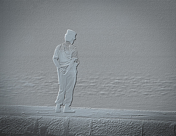 " Lisbon policeman standing on harbour wall looking out to the sea"