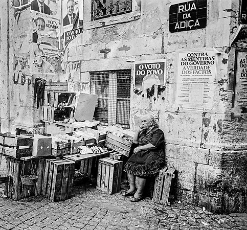 "woman selling fruit and vegetables in the Alfama Quarter, Lisbon"