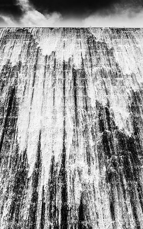 "cascading water as it overtops reservoir spillway"